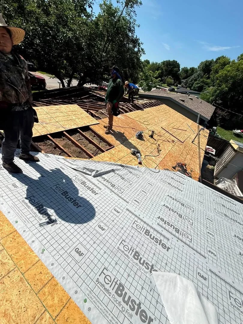 Roof decking replacement with OSB sheathing and synthetic underlayment barrier installation